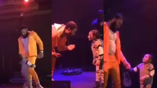 CJ Clinging To Clarence On Stage at Queen Naija Show