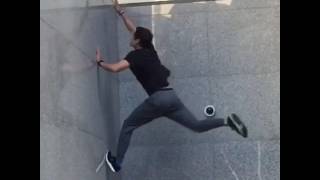 Guy Does 180 Spins All the Way up Wall