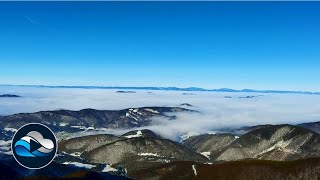 A stream of mist between the mountains time lapse - Relax in Nature with „Cloud Observe“