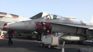 Sailors Aboard The Nimitz-class Aircraft Carrier USS John C. Stennis Perform Operations