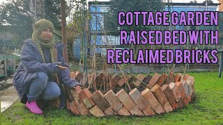 Simple cottage garden raised bed from reclaimed bricks