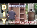 WARDROBE CABINET WITH DRAWER AND HANGING ROD.