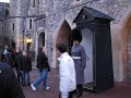 windsor castle guard moving and pushing a teenager