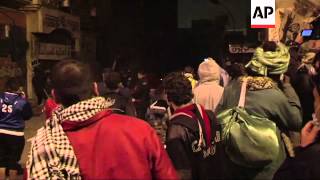 Protesters and riot police clash near Tahrir Square, night shots