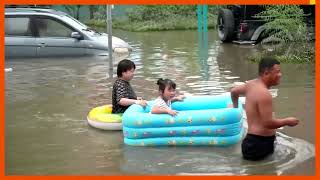 Rescuers use construction loaders in flood-hit China