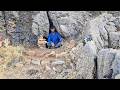 mysterious shelter under rocky cliffs : protection against harsh nature