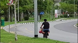 oct2019 foodpanda delivery pmd speeding down the road. with a pillion