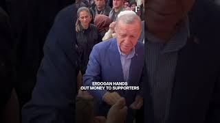 WATCH: Turkey's President Erdogan Hands Out Cash Outside Polling Station