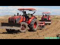 best of tractor team ploughing tractor kubota m6040su at work plowing and pushing the ground