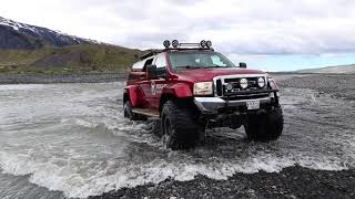 A super jeep by Midgard Adventures crossing Krossá glacial river in Þórsmörk valley