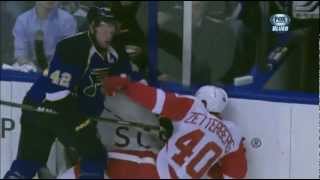 David Backes drills Damien Brunner and Henrik Zetterberg on the same sift