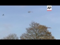 plane with banner asking hollande to step down overflies ahead of ceremony