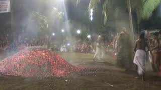 Theyyam Vishnumoorthi Enter  the fire.