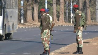 Zimbabwe soldiers enforce protest ban on empty streets of Harare | AFP