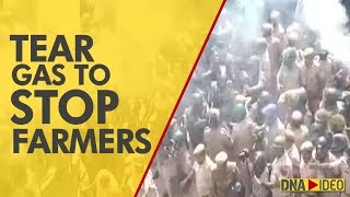 Farmers break barricades at UP-Delhi border, tear gas and water cannons used