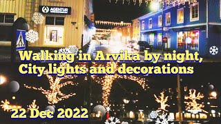 Walking in Arvika by night, city lights and Christmas decorations.