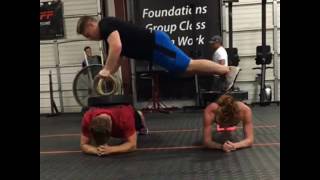 Friends Plank While Others Do Workouts On Top of Them