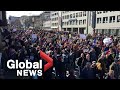 UK police scuffle with anti-lockdown protesters as thousands march in Germany, Austria