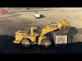 caterpillar 990 wheel loader loading lorries with three passes s.g.m melidis