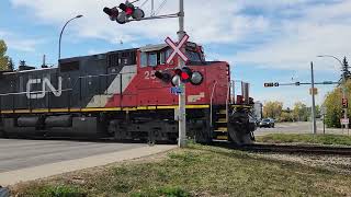 Missing Front Decal? CN 2549 Leads A Northbound Gravel Train With A Wave From The Engineer!