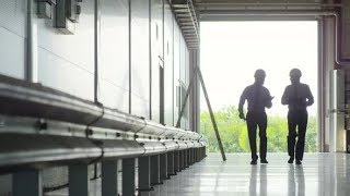 Inspectors entering spacious industrial warehouse | Stock Footage - Videohive