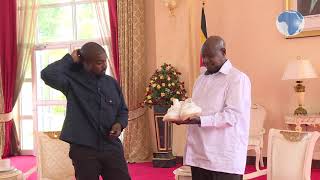 Musician Kanye West gifts Uganda's Museveni a pair of white sneakers