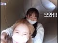 heejin and chuu jumping off a mini slide. 2021