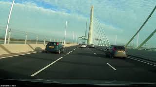 Drive over Mersey Gateway Bridge near Runcorn toward the M56