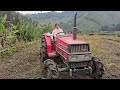 girl driving agricultural machinery to dry soil and harrow fields for villagers