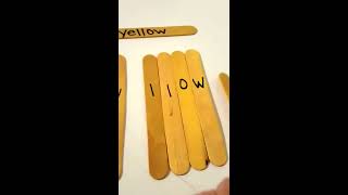 Teaching 2 year old the color yellow using popsicle sticks