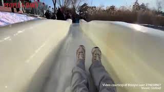 Have an exciting ice slide experience in Beijing's Taoranting Park!