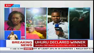 Nyeri residents react after Uhuru Kenyatta was declared president-elect in Kenya’s 2017 poll