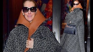 Celine Dion shows off her signature quirky style as she dons an oversized coat with HUGE leather col