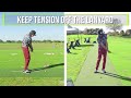 the key to a tension free golf swing