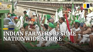 India’s farmers block roads, railways as protests resume a year after farm laws enacted