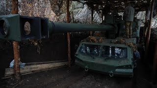 Members of Ukrainian army's Azov Brigade use newly arrived howitzers on frontline