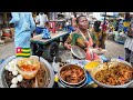 Delicious African street food in the biggest market in Togo west Africa. Assigame food vlog.