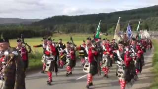 2016 Lonach and Atholl Highlanders march through Strathdon in the Cairngorms Scotland