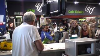 Baobab Sisters singing at a gas station