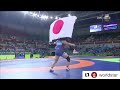 japanese wrestler risako kawai throws coach on the mat after winning olympic gold