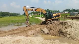 Caterpillar 3200 excavator operator view performing road leveling