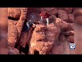 Men are caught on camera pushing over rock formations near Lake Mead