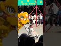 3911 lion dancer interacts with baby girl in china