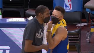 Kevin Durant giving hugs to Steph Curry, Klay and Draymond after the game