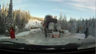 Richards Transports 64 wheeler hauling a demethanizer tower down a step hill over a tight bridge.mov