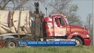 HAZMAT crews cleaning sealant spill in rollover