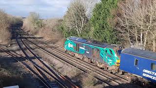 68016 tnt 68006 with a Nuclear Flask and Escort Vehicles at Hatton on 20 January 2023.