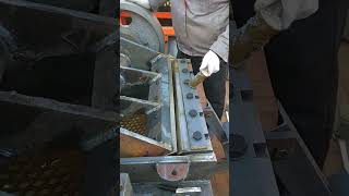 The process of tapping the crusher with a hammer