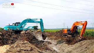 Heavy Construction Equipment Komatsu Kobelco and Hitachi Excavator Working Building a River