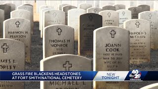 Grass fire blackens headstones at Fort Smith National Cemetery